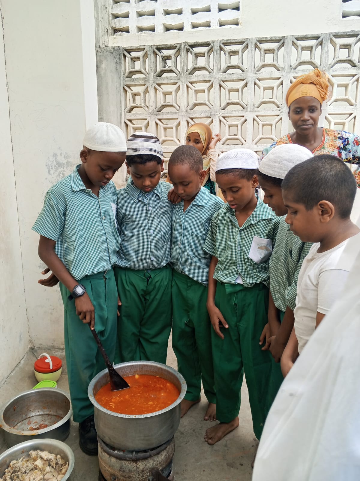 Learners taking part in a supervised cooking activity