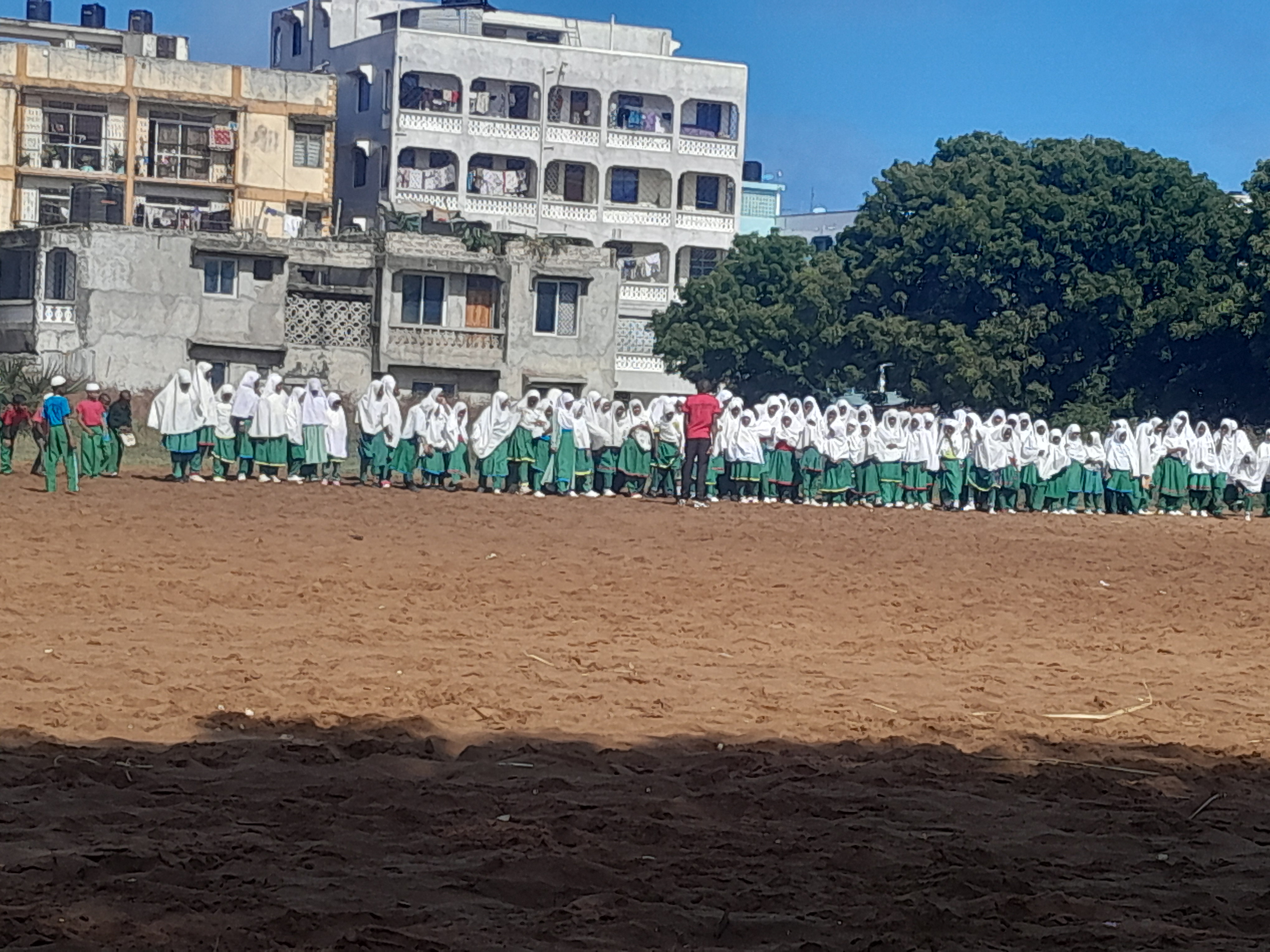Learners gathered together on a school playing field